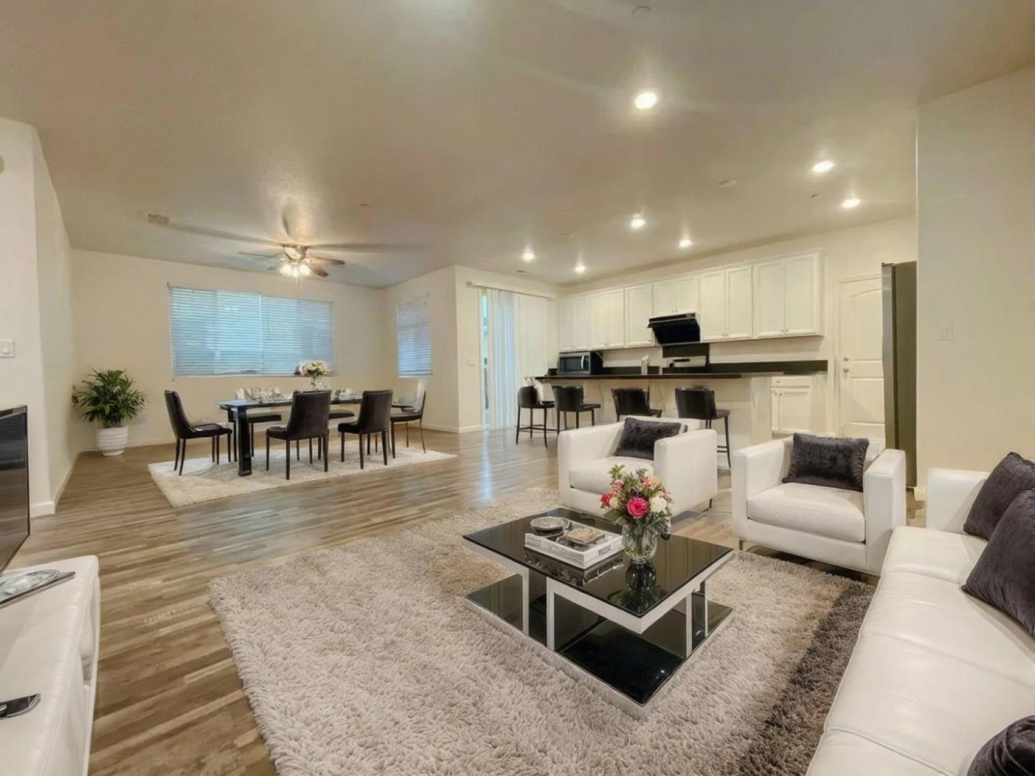 3781 Samuelson Way Sacramento, CA 95834 - Photo 12 of 42 a living room with furniture and kitchen view