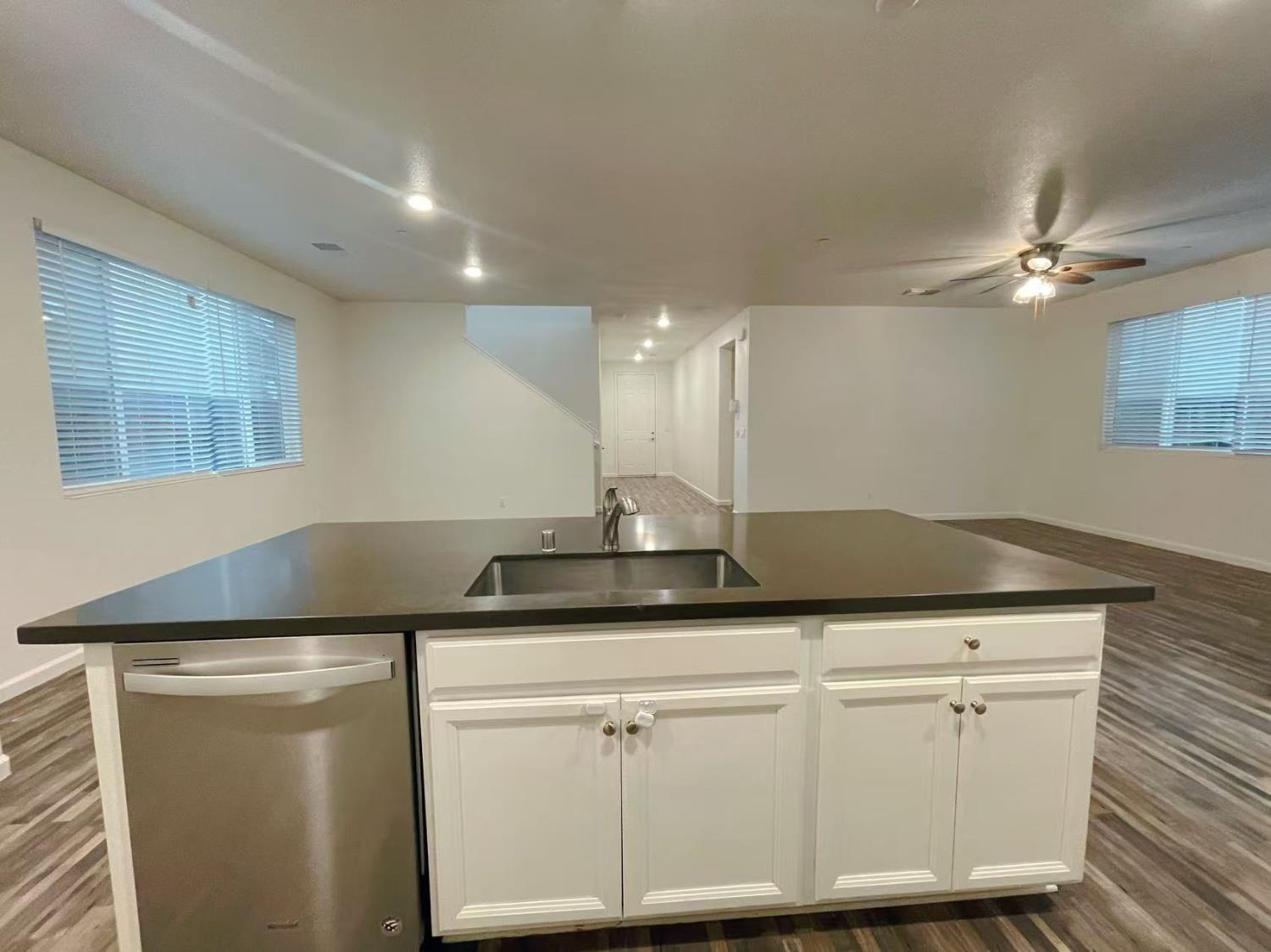 3781 Samuelson Way Sacramento, CA 95834 - Photo 17 of 42 a sink with white cabinets