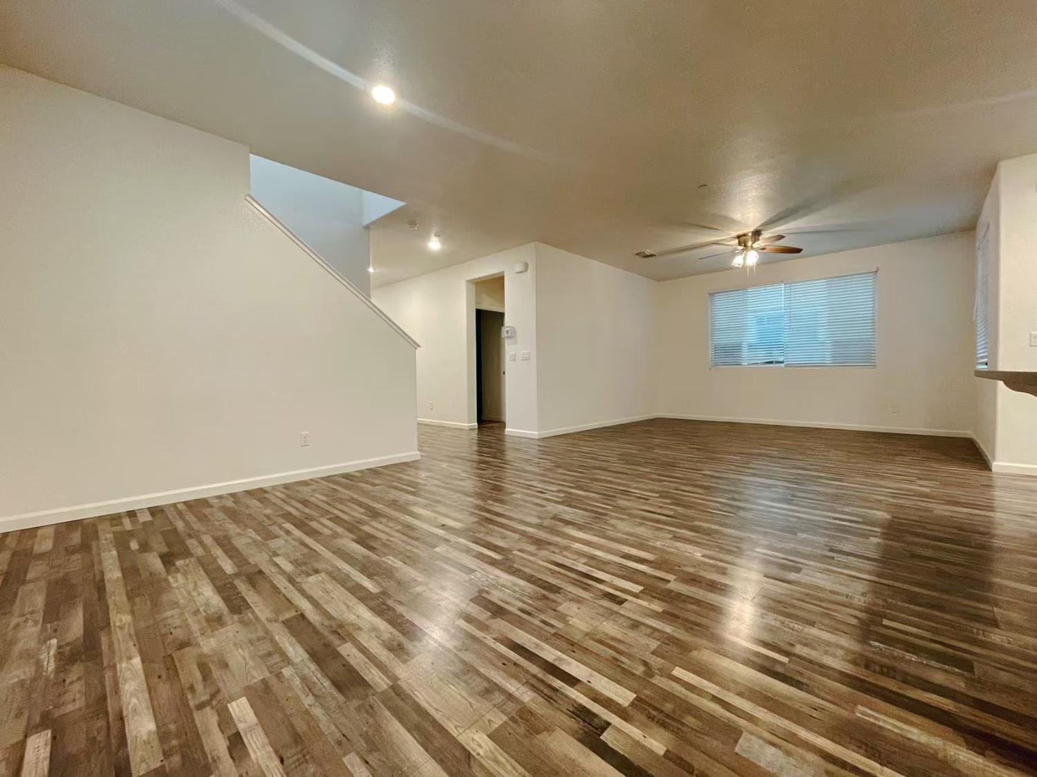 3781 Samuelson Way Sacramento, CA 95834 - Photo 18 of 42 an empty room with wooden floor and windows