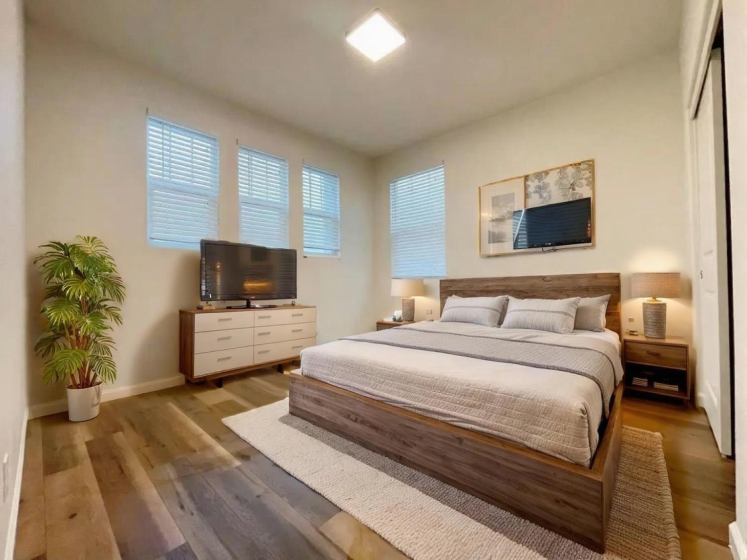 3781 Samuelson Way Sacramento, CA 95834 - Photo 24 of 42 a bedroom with a bed and a television