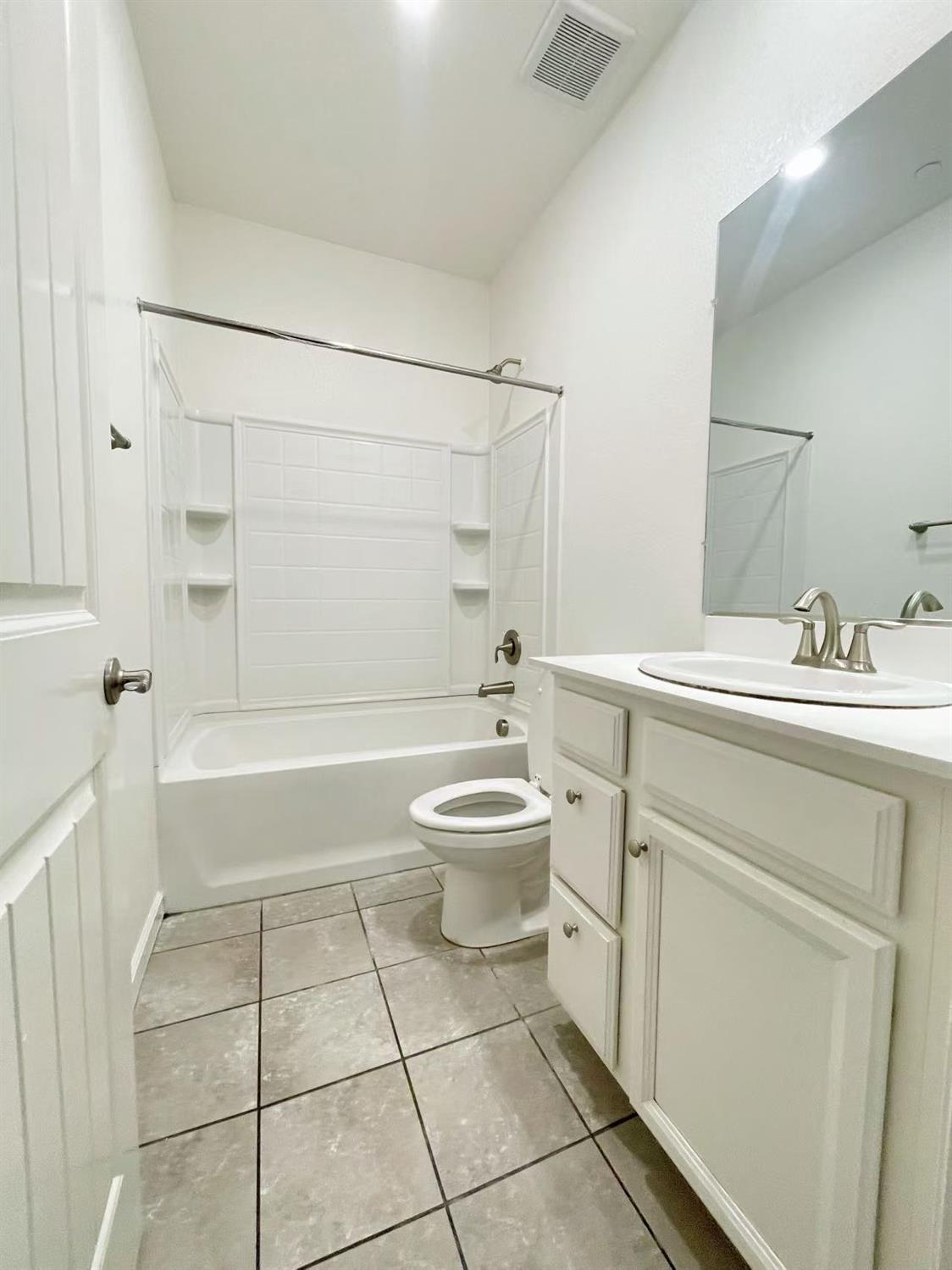3781 Samuelson Way Sacramento, CA 95834 - Photo 8 of 42 a bathroom with a sink a toilet and shower