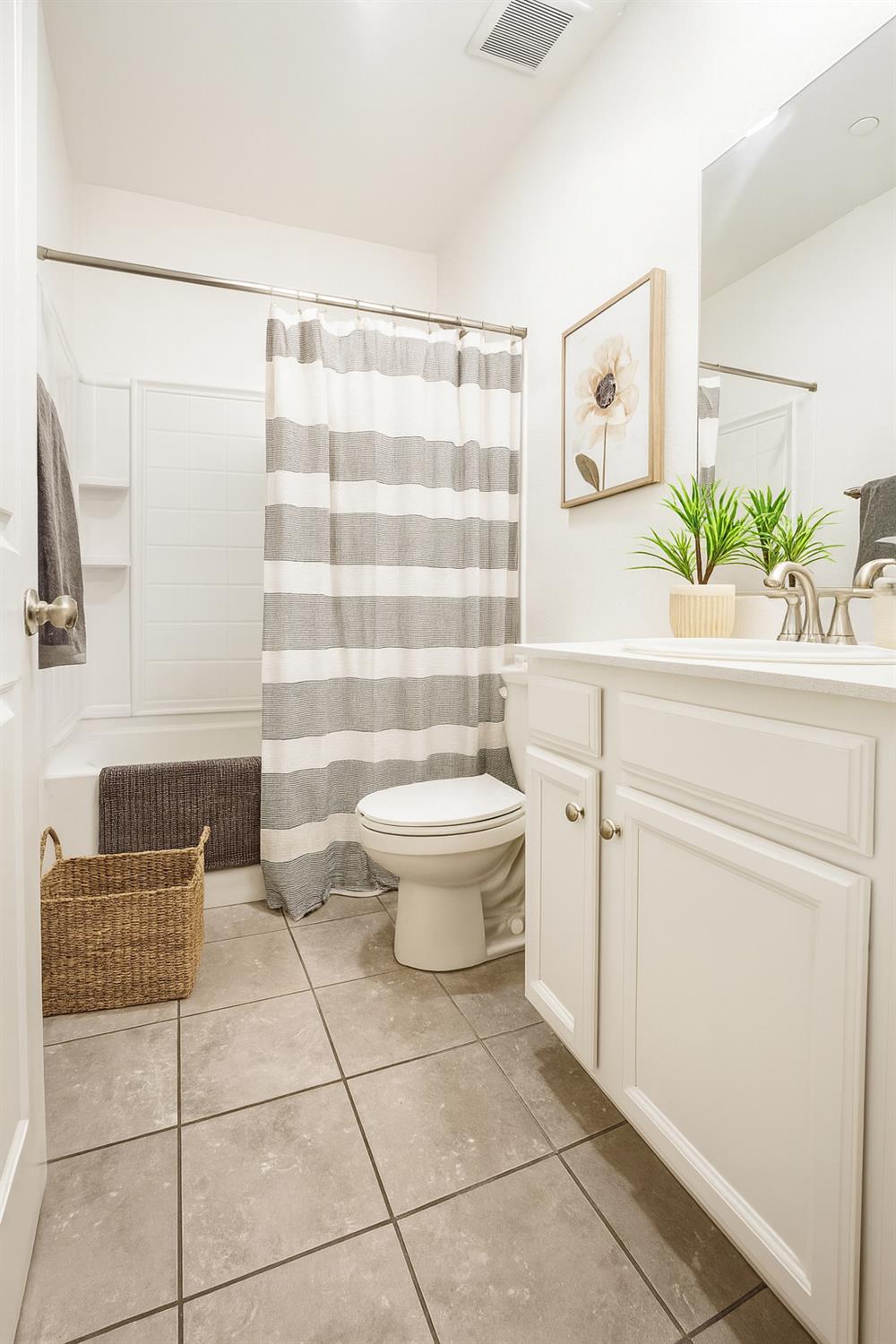 3781 Samuelson Way Sacramento, CA 95834 - Photo 9 of 42 a bathroom with a sink toilet and shower