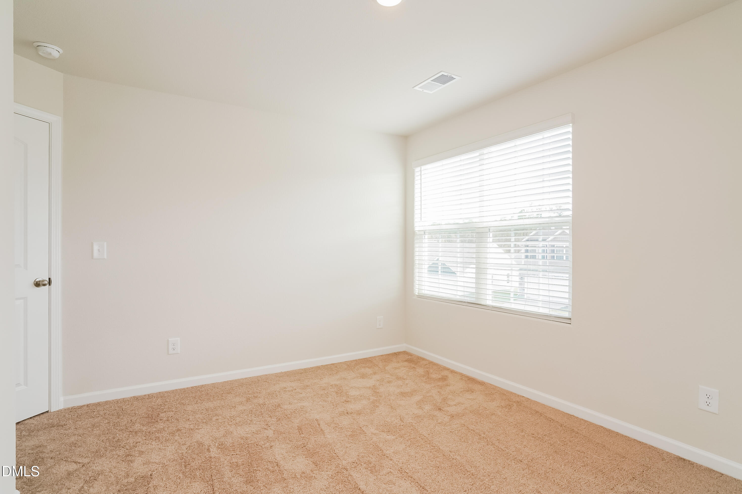 741 Cider Ml Way Zebulon, NC 27597 - Photo 11 of 17 an empty room with a window