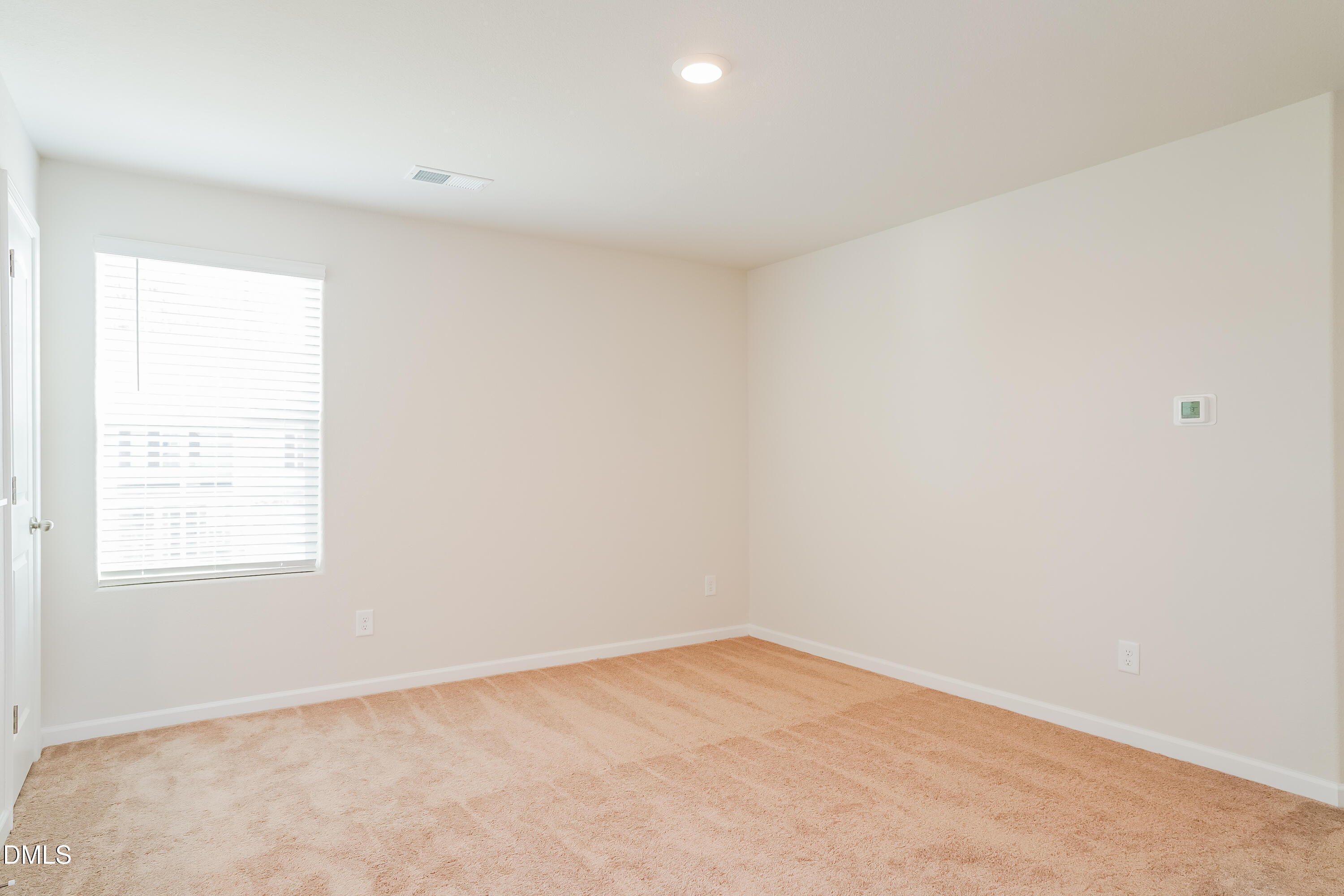 741 Cider Ml Way Zebulon, NC 27597 - Photo 13 of 17 an empty room with a window