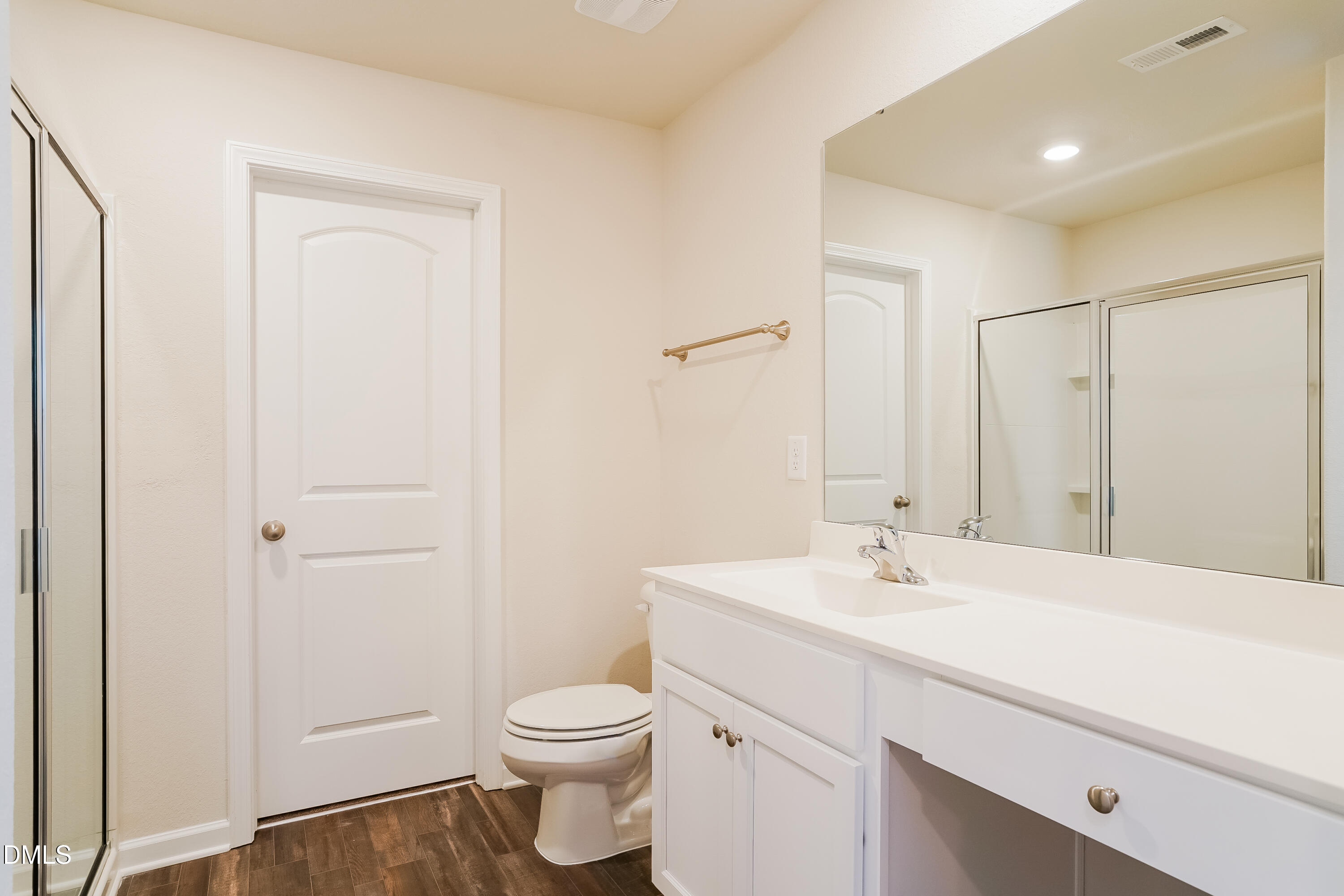741 Cider Ml Way Zebulon, NC 27597 - Photo 9 of 17 a bathroom with a sink a toilet and a mirror