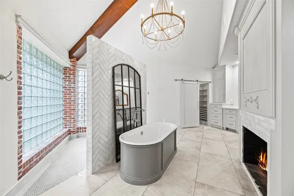 a bathroom with a toilet a sink and bathtub