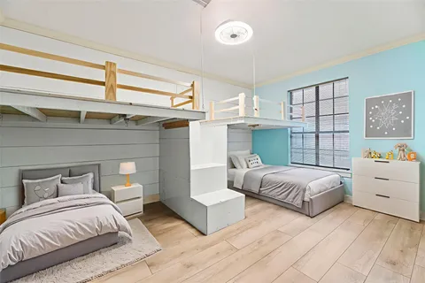 a bedroom with a bed and a dresser