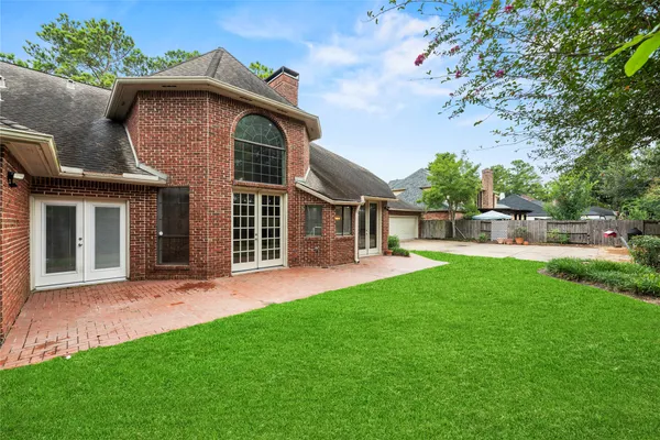 a view of an house with backyard space and garden