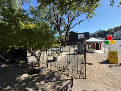 a view of a backyard with a sitting area