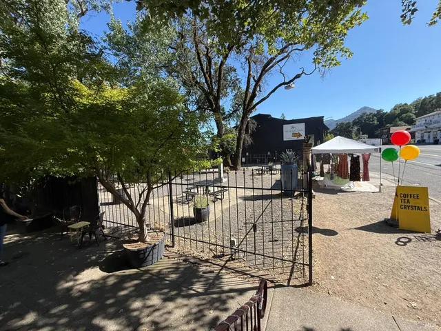 a view of a backyard with a sitting area