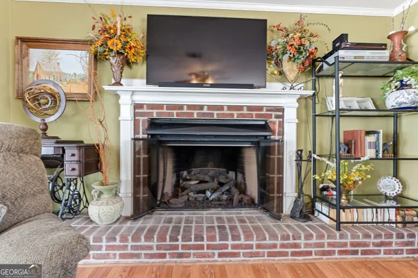 a view of a livingroom with furniture and a fireplace
