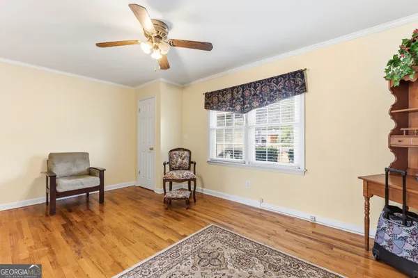 a living room with furniture and a window