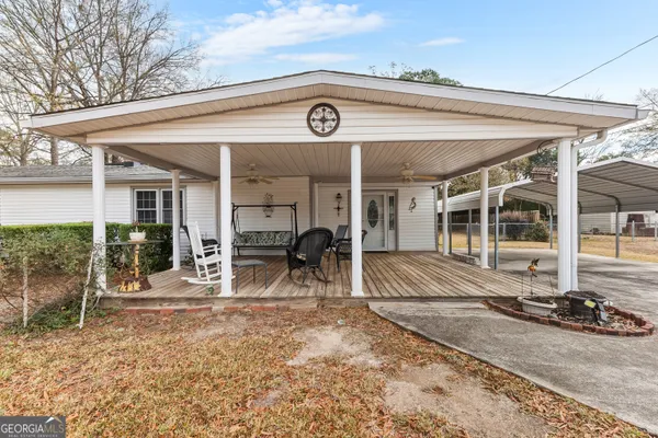 a view of a dinning room with table and chairs