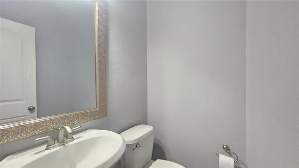 a bathroom with a sink and a toilet