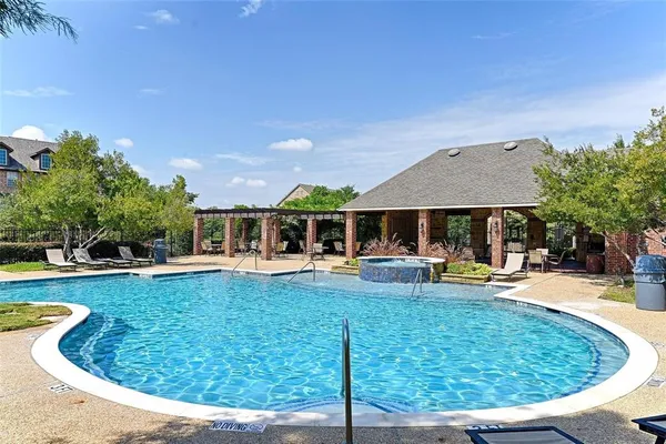 a swimming pool with outdoor seating yard and barbeque oven