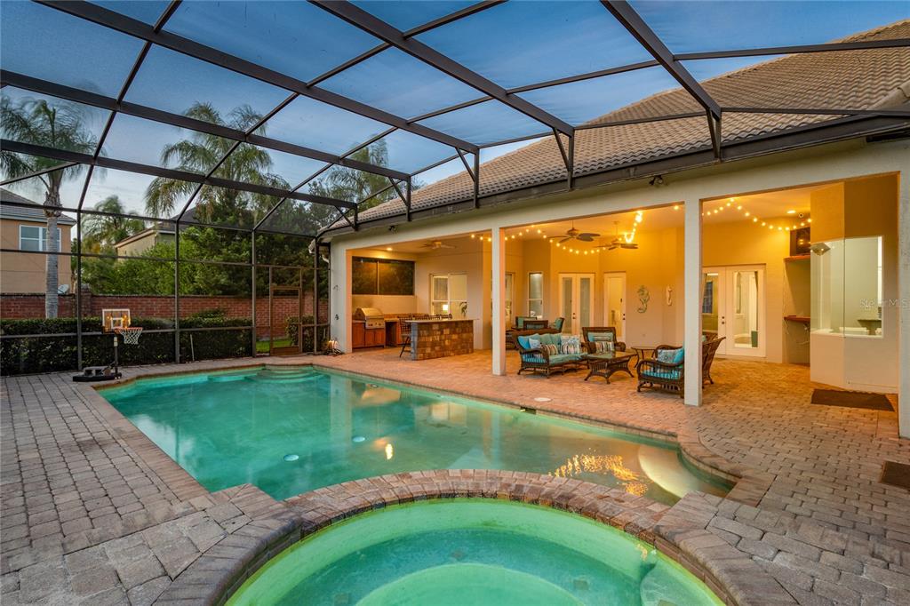 2002 Water Key Drive Windermere, FL 34786 - Photo 40 of 60 a view of a swimming pool with a patio