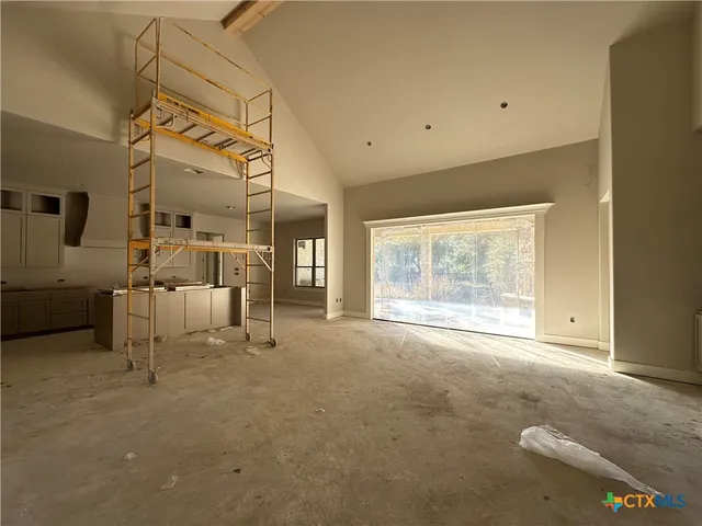 a view of a livingroom with furniture and a window