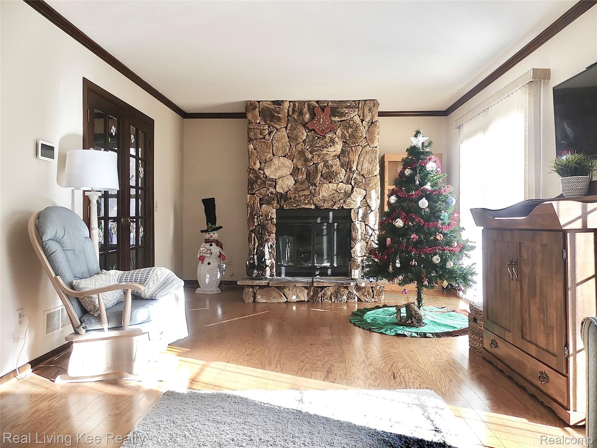1326 Brook Lane Rochester, MI 48306 - Photo 10 of 47 Living room is very bright & spacious w/ 2 doorwalls, fireplace, french doors to foyer