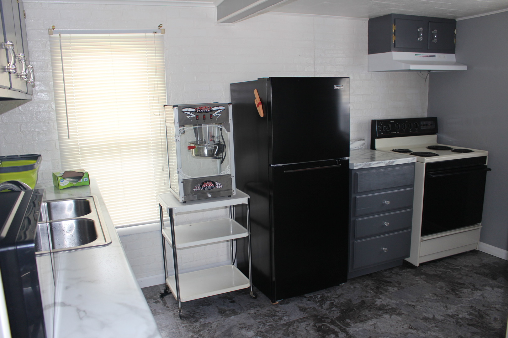 216 South Grant Street Clinton, IL 61727 - Photo 11 of 29 a kitchen with a refrigerator stove and sink