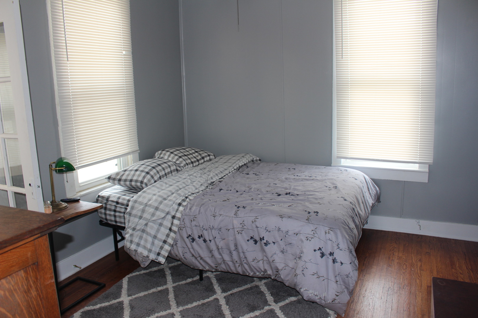 216 South Grant Street Clinton, IL 61727 - Photo 19 of 29 a bedroom with a bed and a window