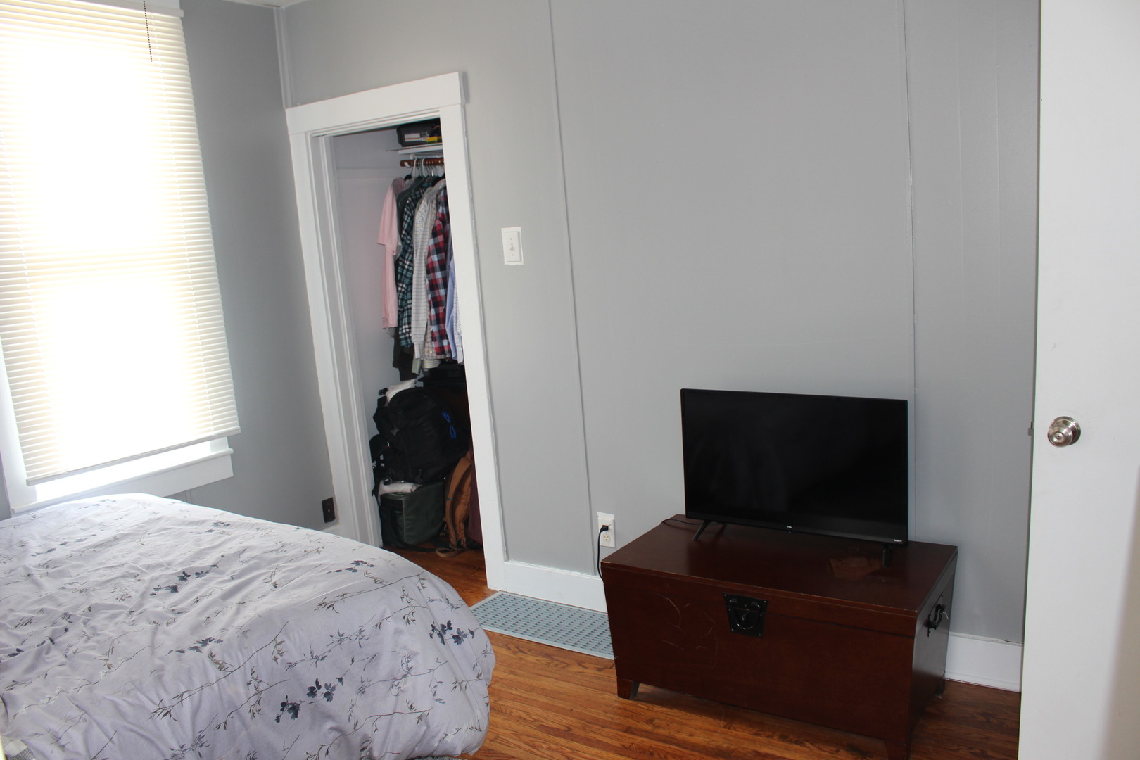 216 South Grant Street Clinton, IL 61727 - Photo 20 of 29 a bedroom with a bed and a flat screen tv
