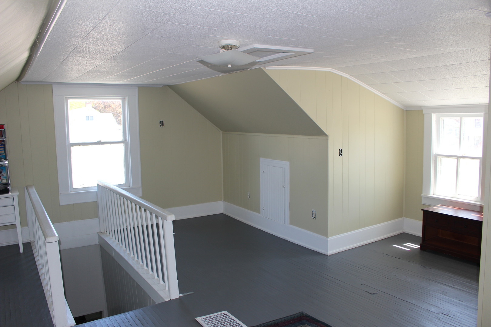 216 South Grant Street Clinton, IL 61727 - Photo 27 of 29 a view of an empty room with wooden floor and a window