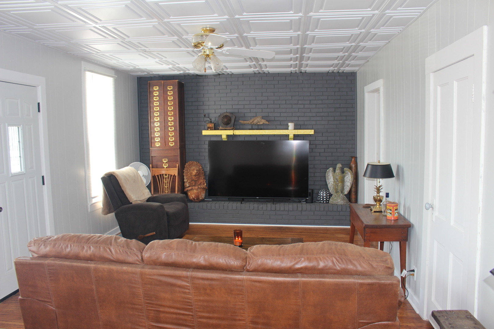 216 South Grant Street Clinton, IL 61727 - Photo 6 of 29 a living room with furniture and a fireplace