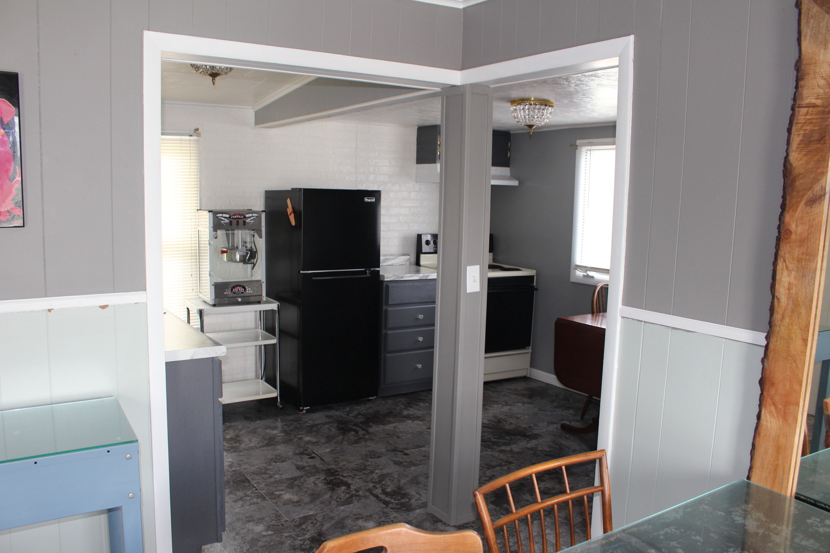 216 South Grant Street Clinton, IL 61727 - Photo 10 of 29 a kitchen with a refrigerator and cabinets