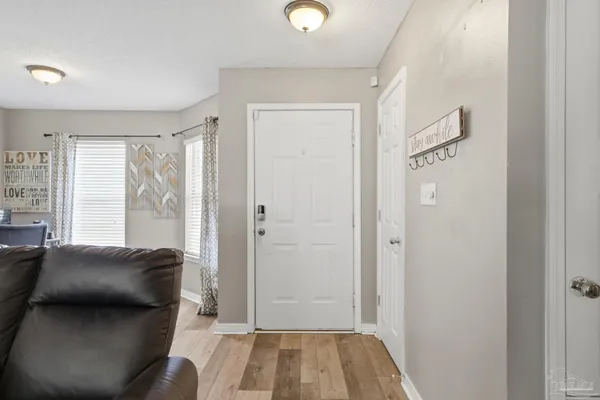 a view of bedroom with furniture and windows