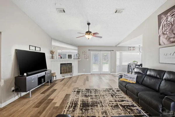 a living room with furniture and a flat screen tv