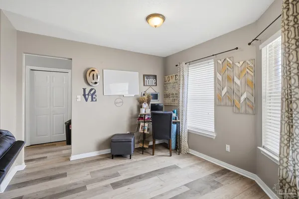 a view of room with window and furniture