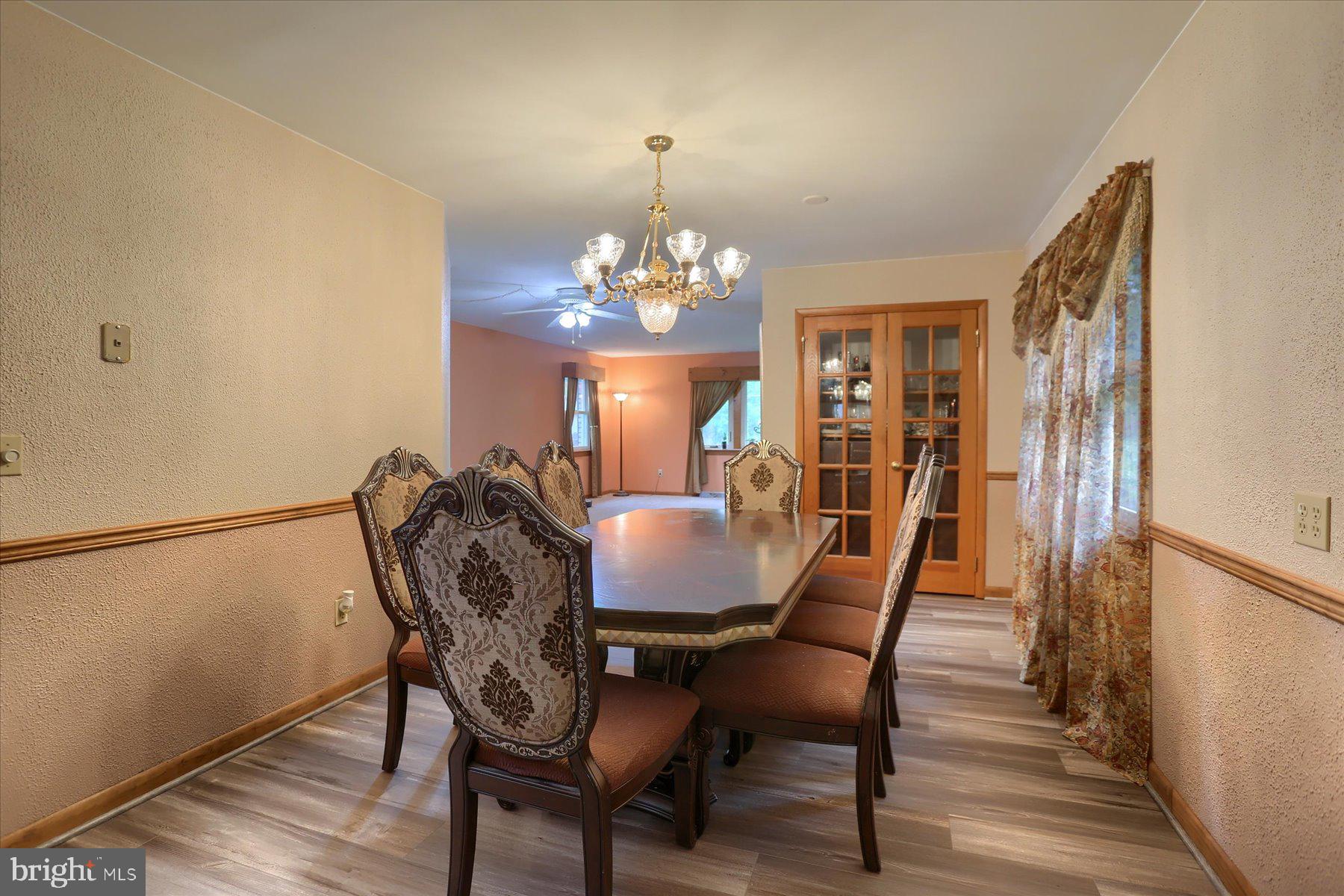 12 South Ridge Road Boiling Springs, PA 17007 - Photo 6 of 39 a view of a dining room with furniture and chandelier