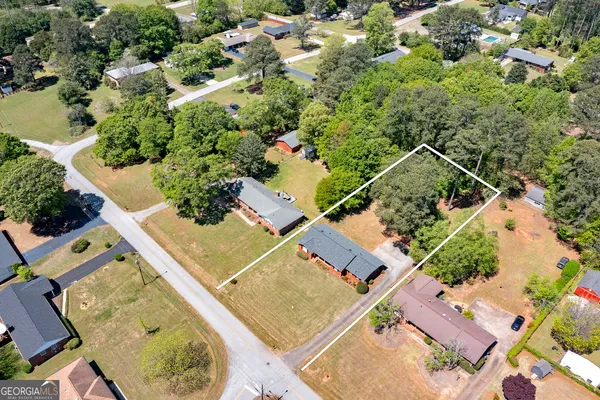 an aerial view of residential house with outdoor space