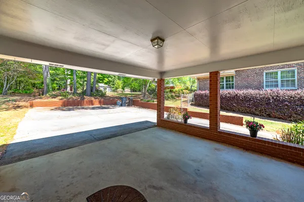 a view of room with large windows and floor to ceiling window