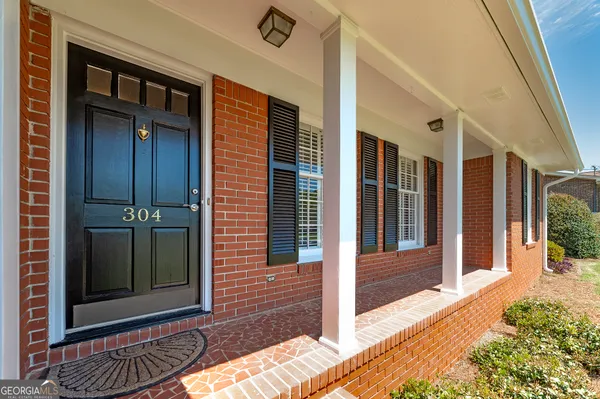 a view of a brick house with a large window