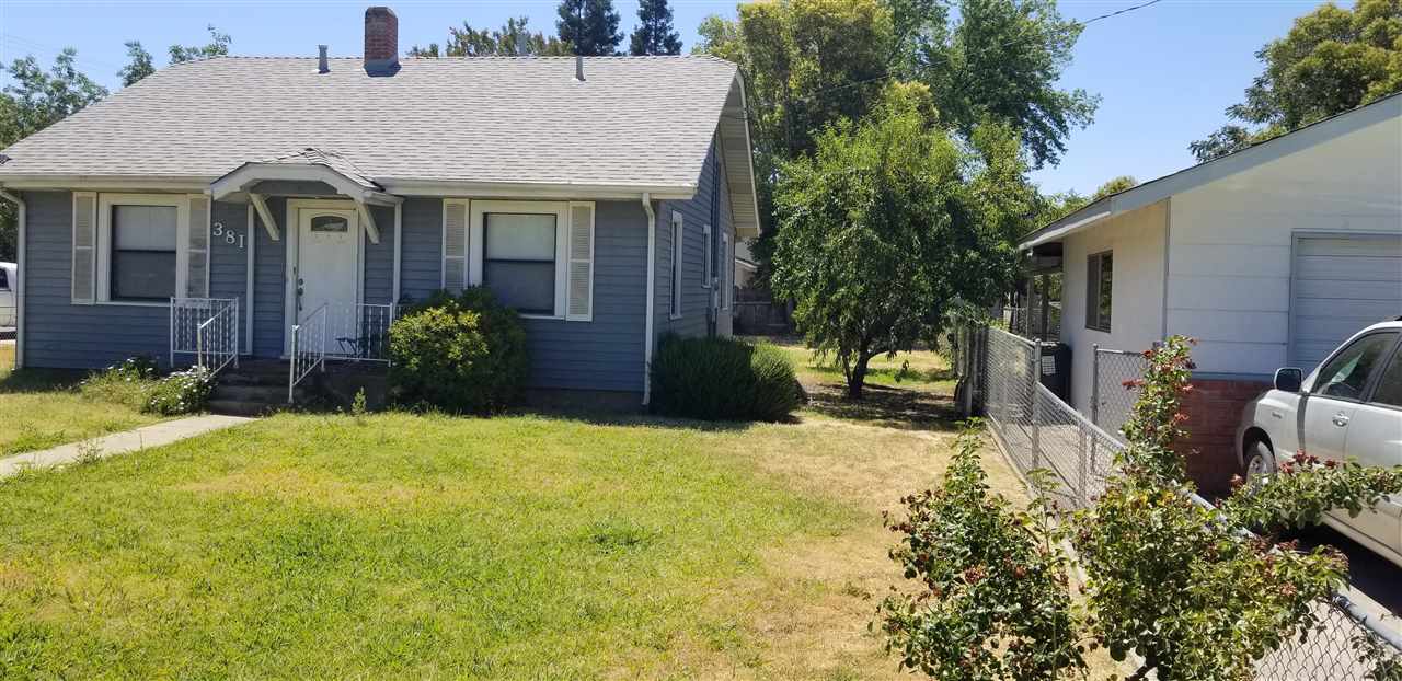 381 Aleut Street Biggs, CA 95917 - Photo 2 of 35 a view of a house with backyard and garden
