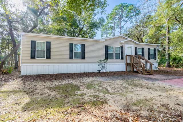 a house with trees in the background