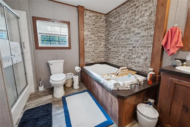 a bathroom with a sink a mirror and a shower