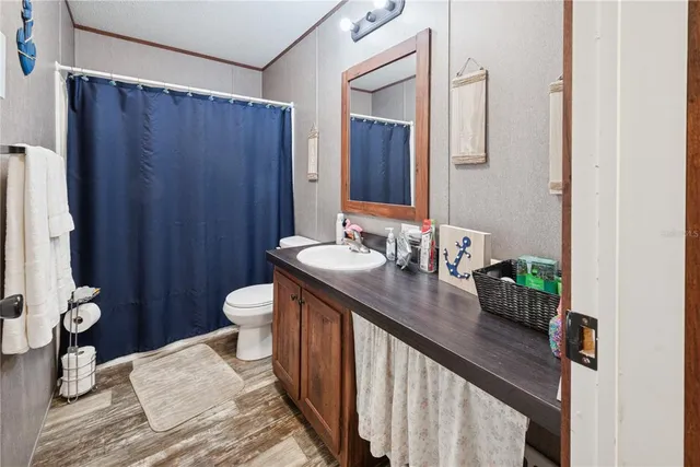 a bedroom with a bed chair and a desk