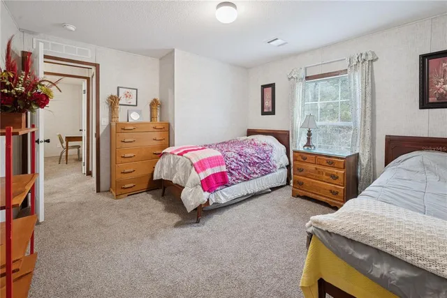 a bedroom with bed and a window