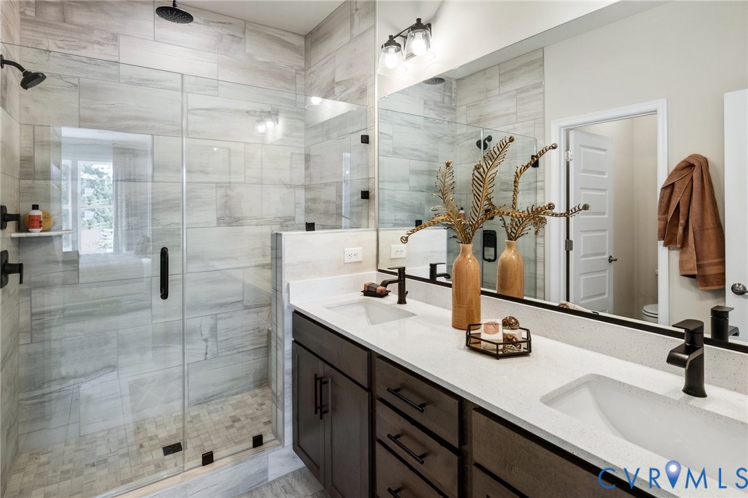 16120 Esteem Way Midlothian, VA 23113 - Photo 20 of 42 a bathroom with double vanity and a shower
