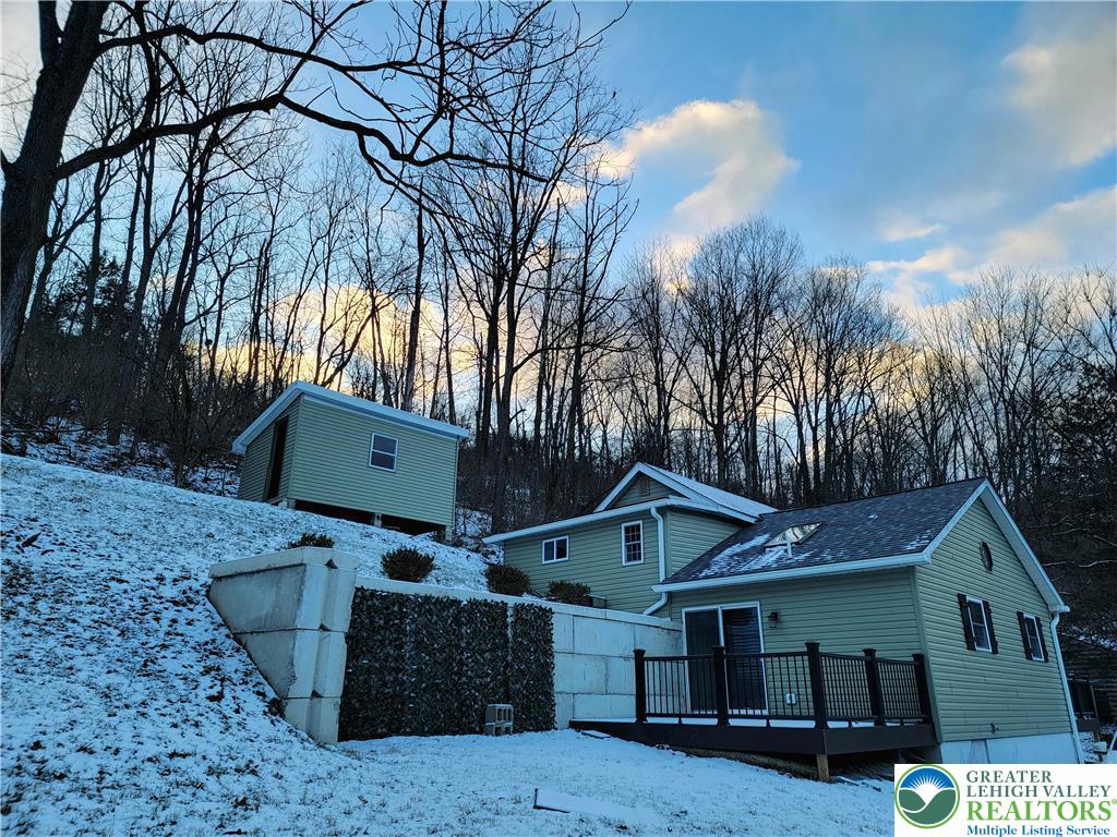 169 Hatch Gravel Road Bath, PA 18014 - Photo 2 of 7 a front view of a house with a yard and garage