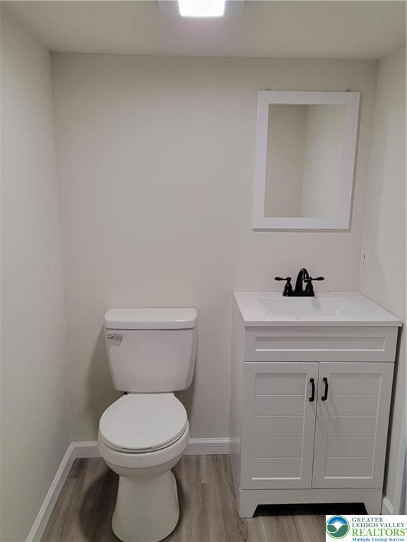 169 Hatch Gravel Road Bath, PA 18014 - Photo 5 of 7 a bathroom with a toilet a sink and mirror