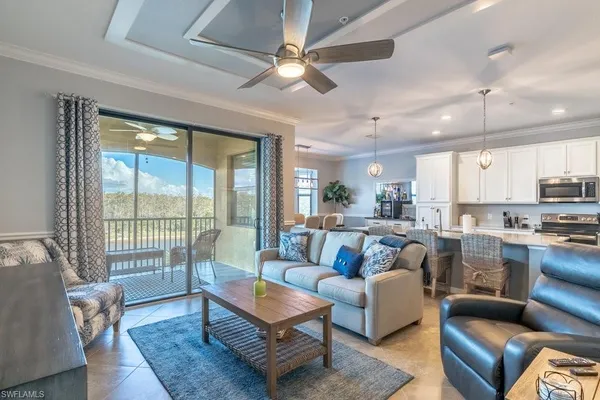 a living room with furniture wooden floor and a table