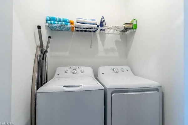 a utility room with dryer and washer