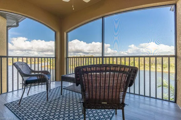 a view of balcony with wooden floor