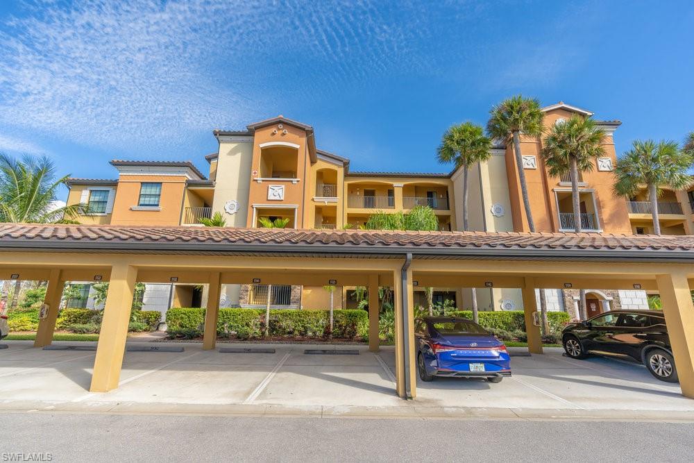 9578 Trevi Court, Unit 5142 Naples, FL 34113 - Photo 2 of 49 front view of a brick building
