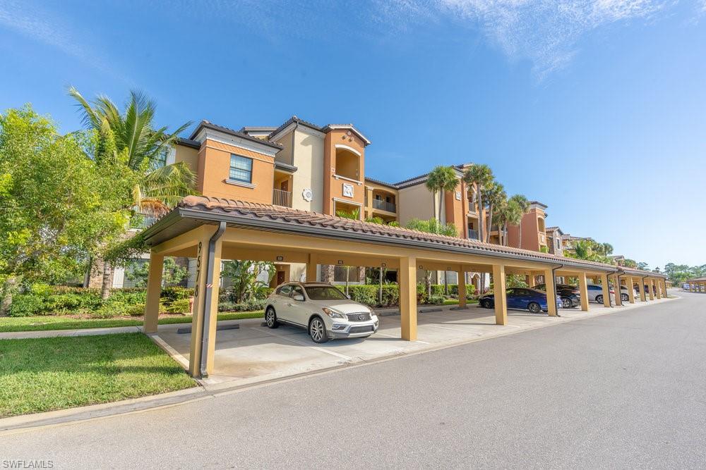 9578 Trevi Court, Unit 5142 Naples, FL 34113 - Photo 28 of 49 a car parked on the side of the road
