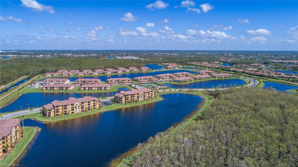 9578 Trevi Court, Unit 5142 Naples, FL 34113 - Photo 31 of 49 a view of a city with an ocean beach