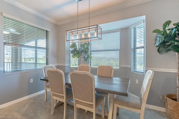a view of a dining room with furniture window and outside view